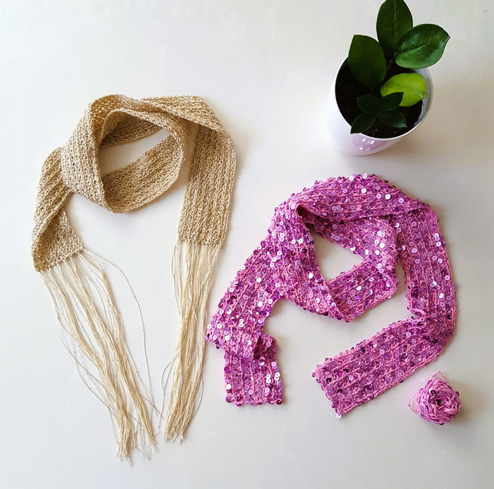 Shine Bright crochet pattern — both versions of the sparkle scarf side by side, champagne with fringe and pink sequin without